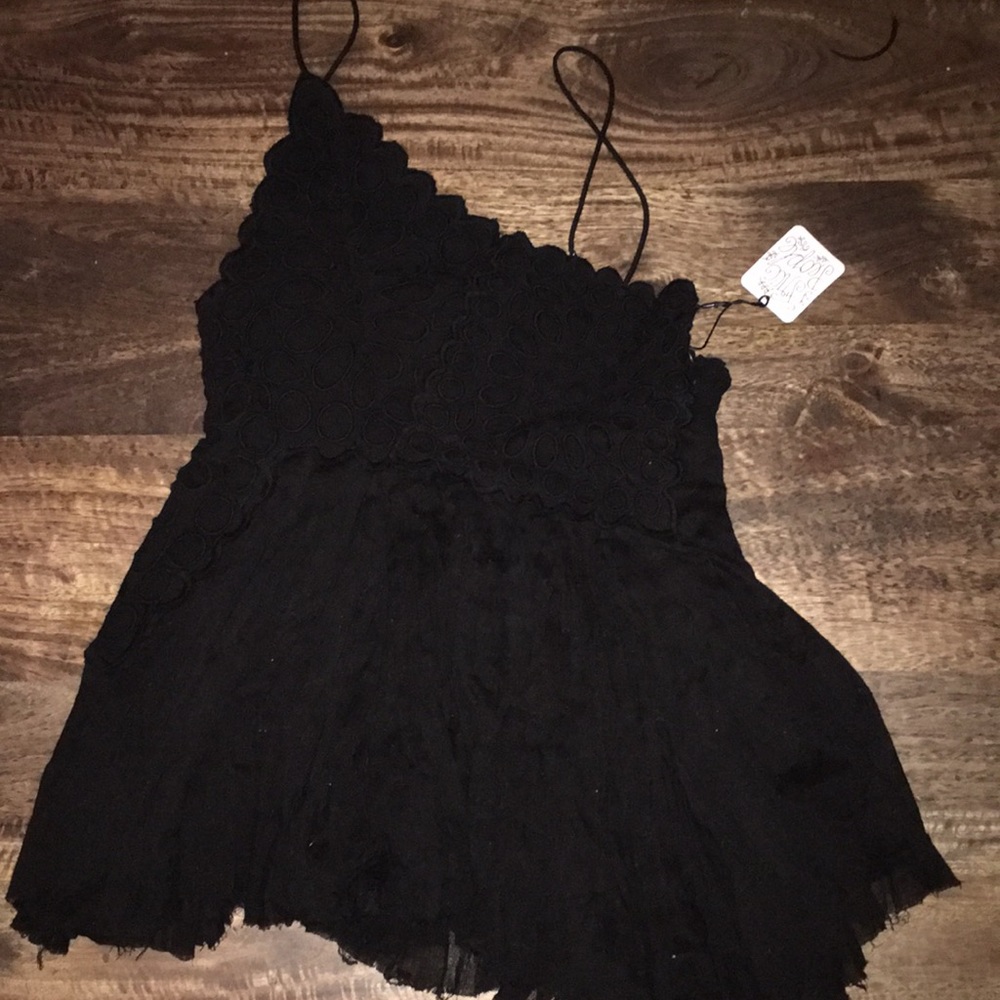Black assymetrical flowy free people top